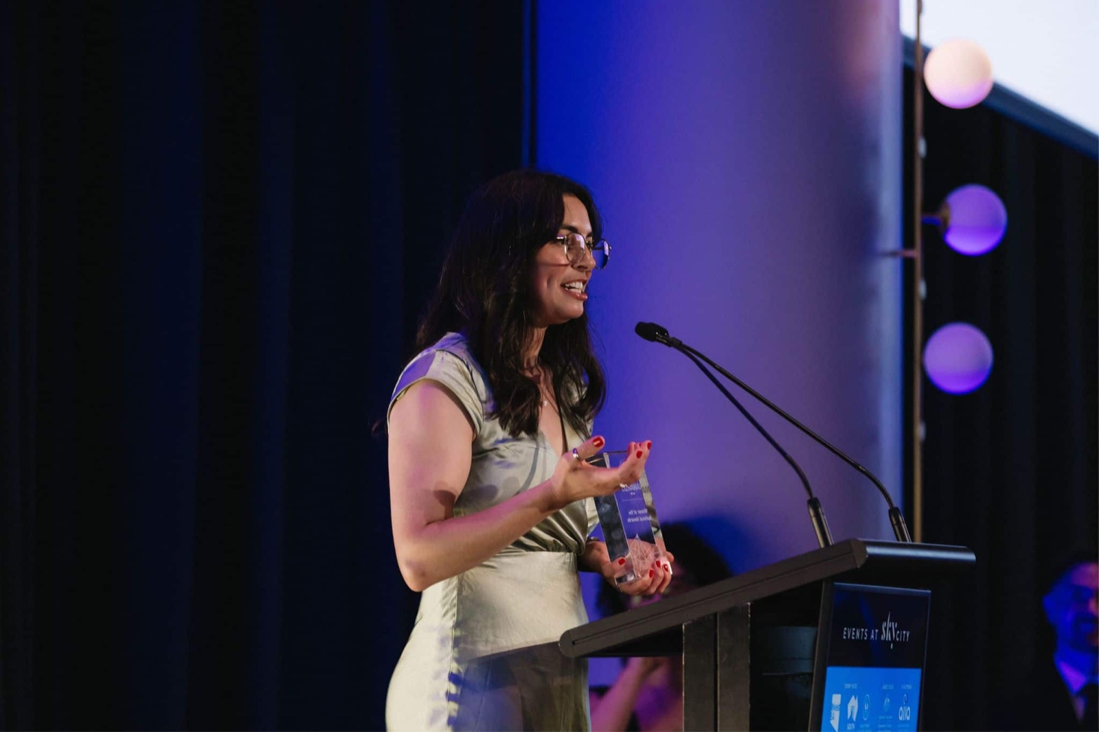 Dr Michèle Masson-Trottier accepting the 2025 National iAward on stage